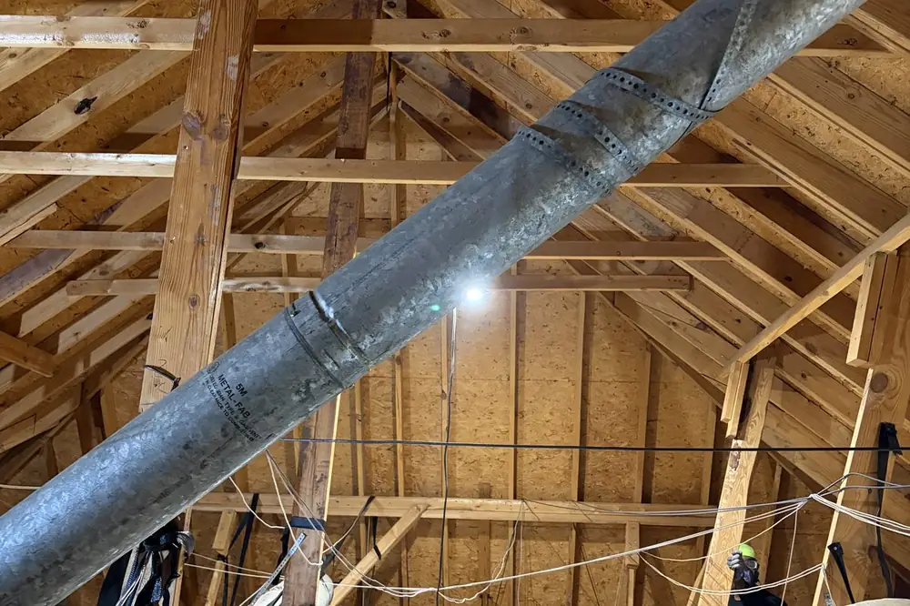 Attic before: exposed joists and old insulation